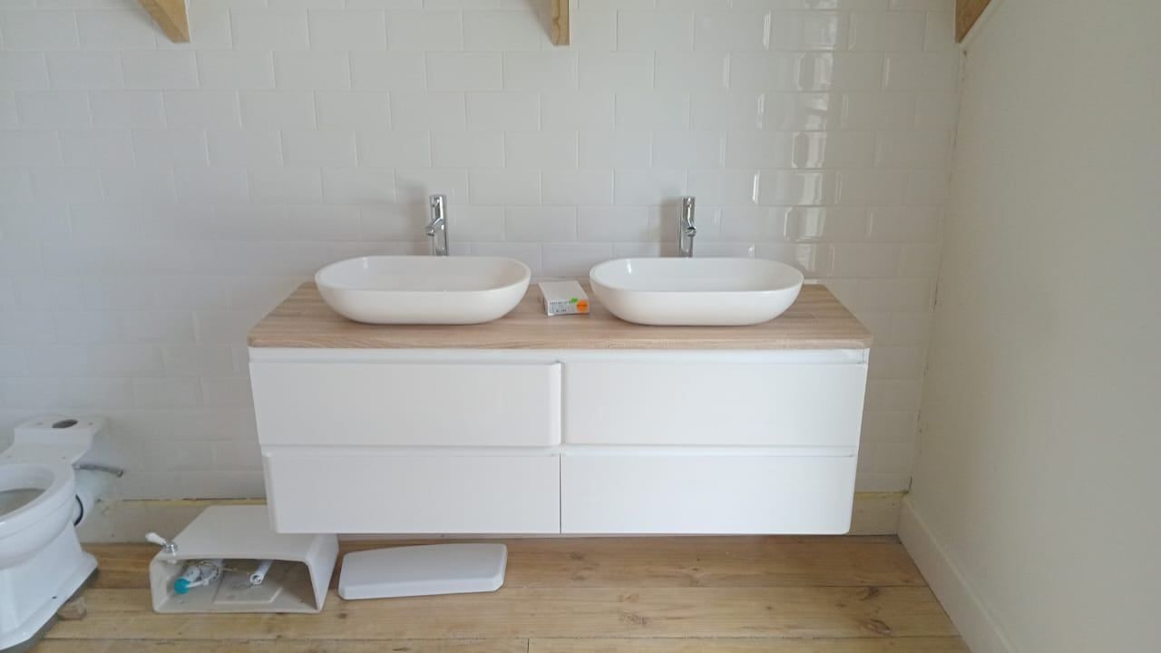 A newly installed double vanity with two basins