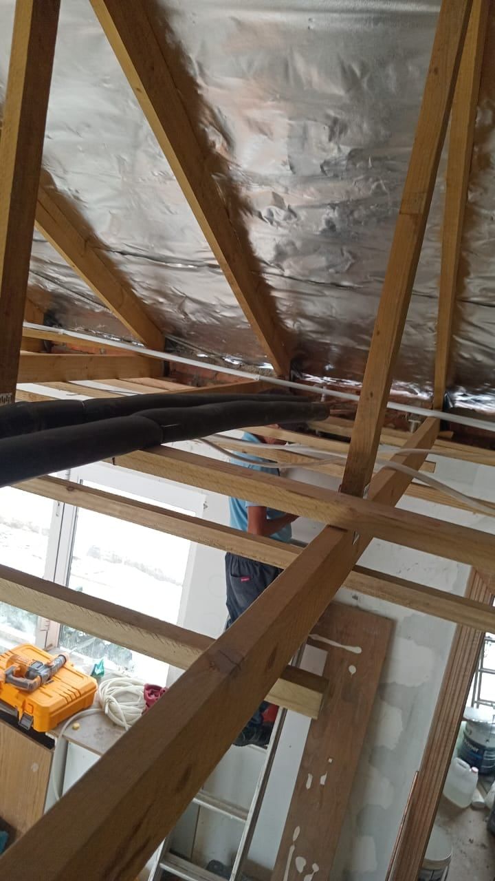 New hot-water pipe runs through the roof trusses