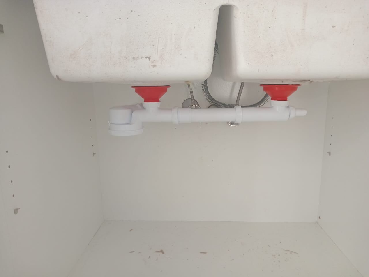 New waste pipework under a double sink